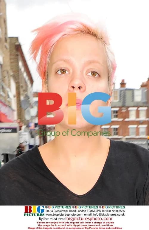 Lily Allen braves rain for shopping in London