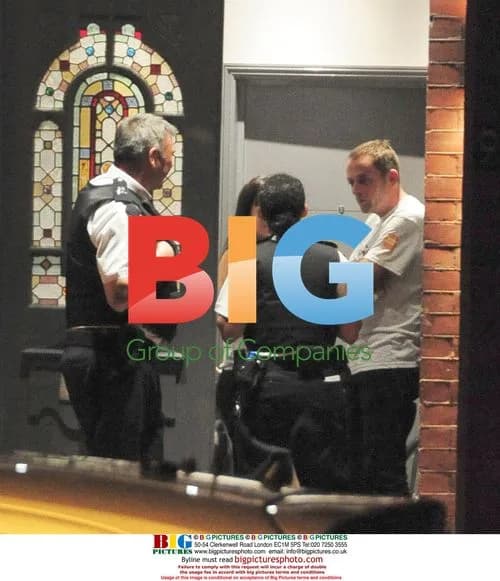 Lily Allen with police at home