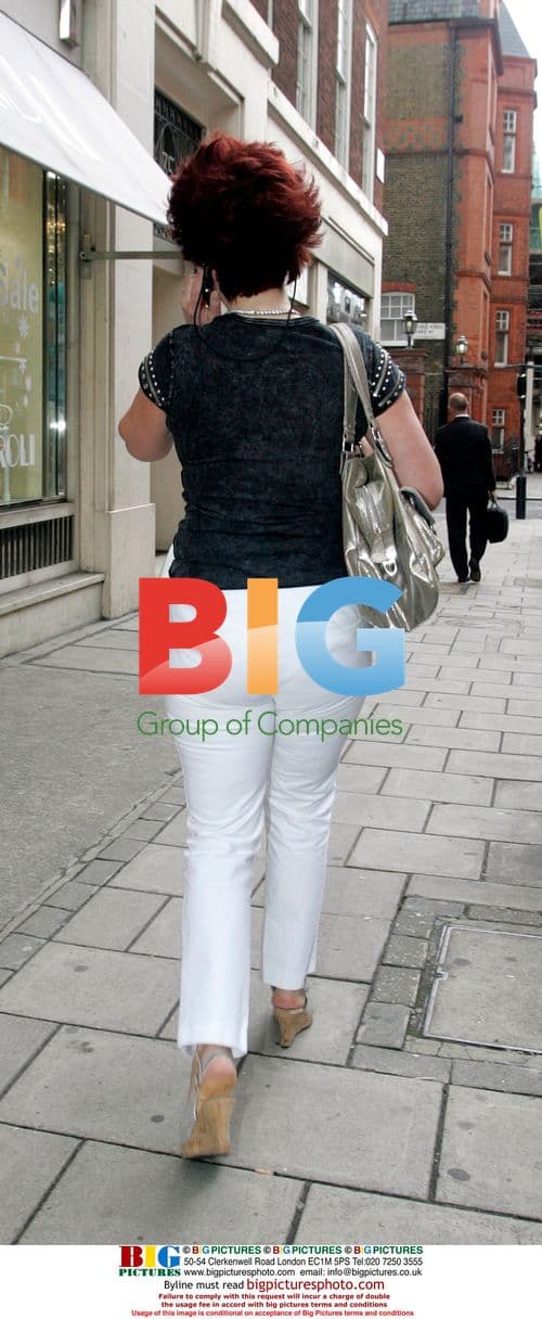 Actress Rula Lenska on mobile in London