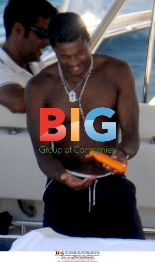 Patrice Evra and wife relax on holiday in Nerano, Italy