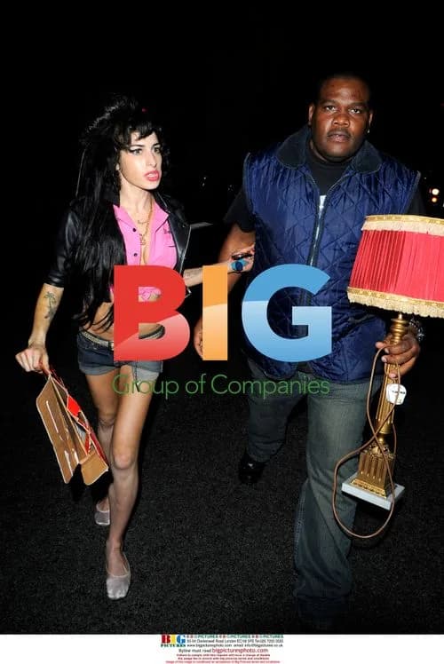 Amy Winehouse leaves The Monarch Bar with security