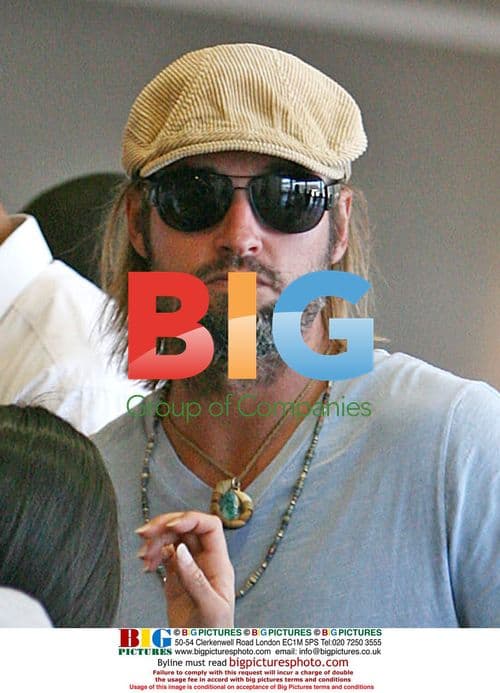 Josh Holloway and wife depart LAX