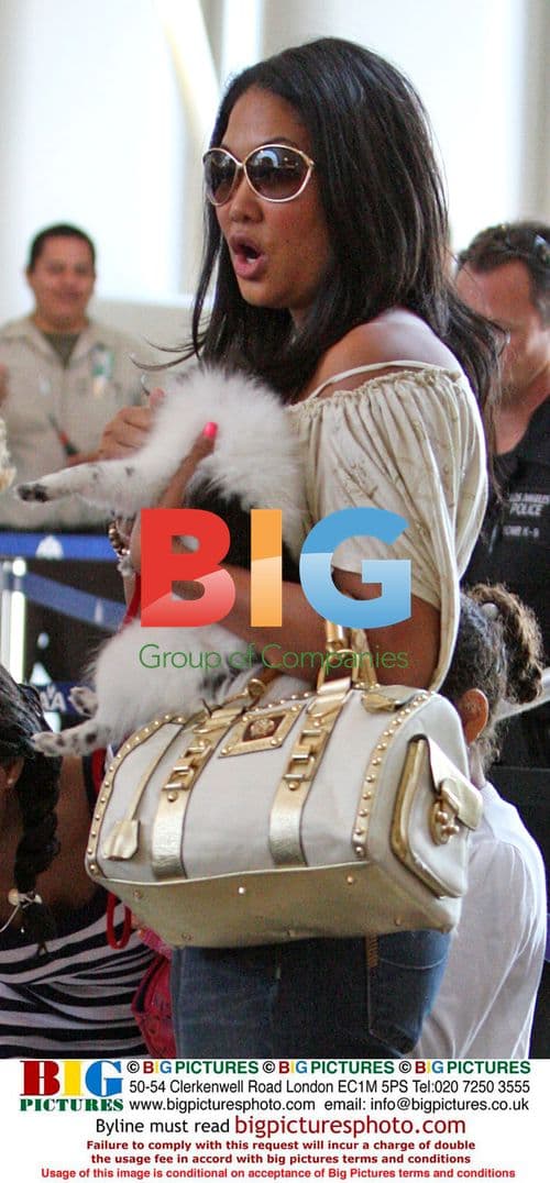 Kimora Lee departs LAX with daughters