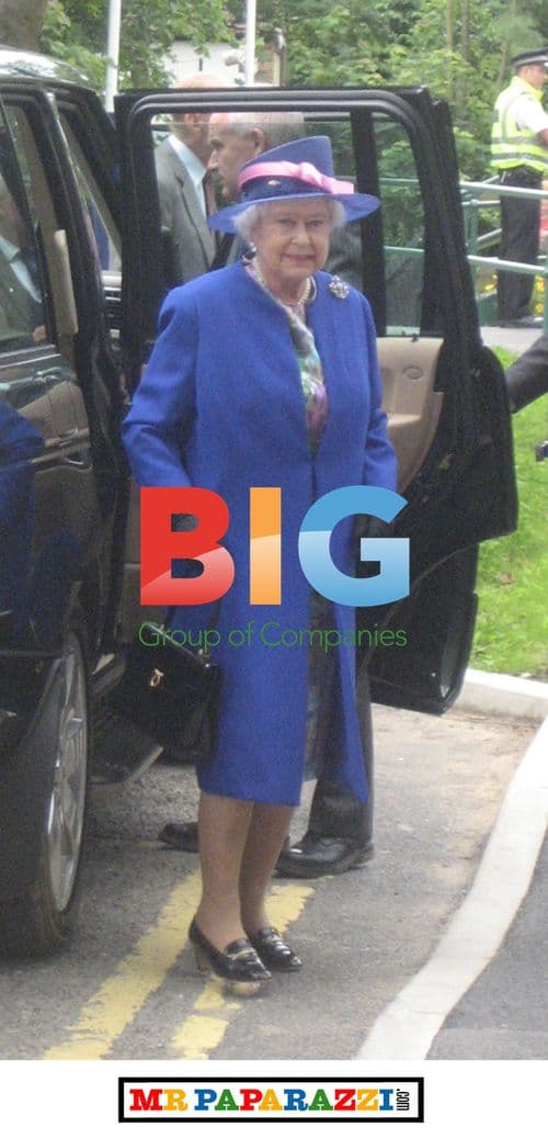 Queen Elizabeth II Waits on Station Platform