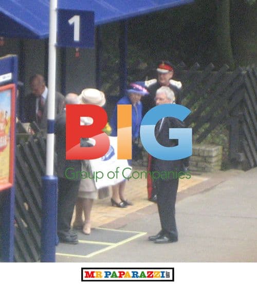 Queen Elizabeth II and Prince Philip Wait for Train