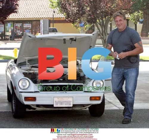 Daniel Baldwin fixes car at Chevron station