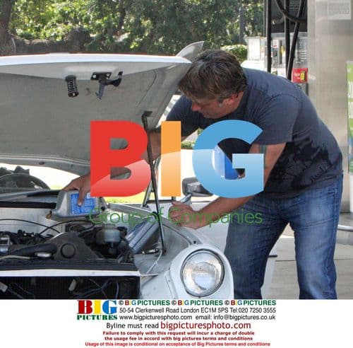 Daniel Baldwin Fixes Car at Chevron Station