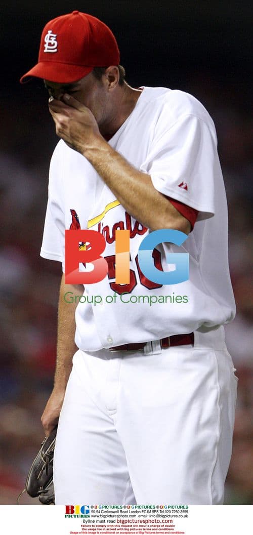 Adam Wainwright covers face after grand slam