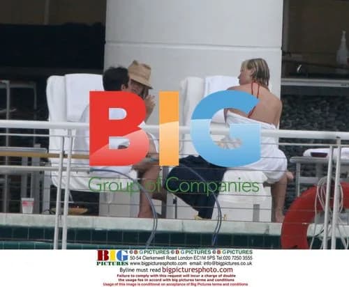 Jennifer Aniston Relaxes by Pool in Miami