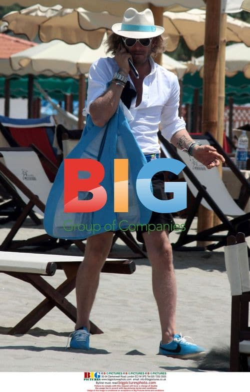 Lapo Elkann on beach with friends