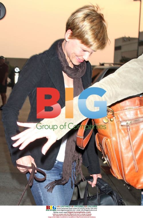 Hilary Swank arrives at LAX with new hairdo