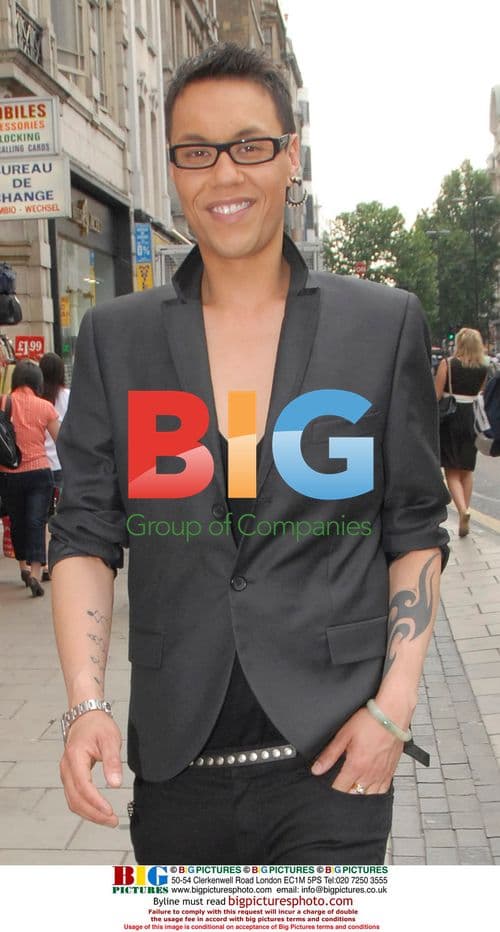 Gok Wan smiles on Oxford Street, London