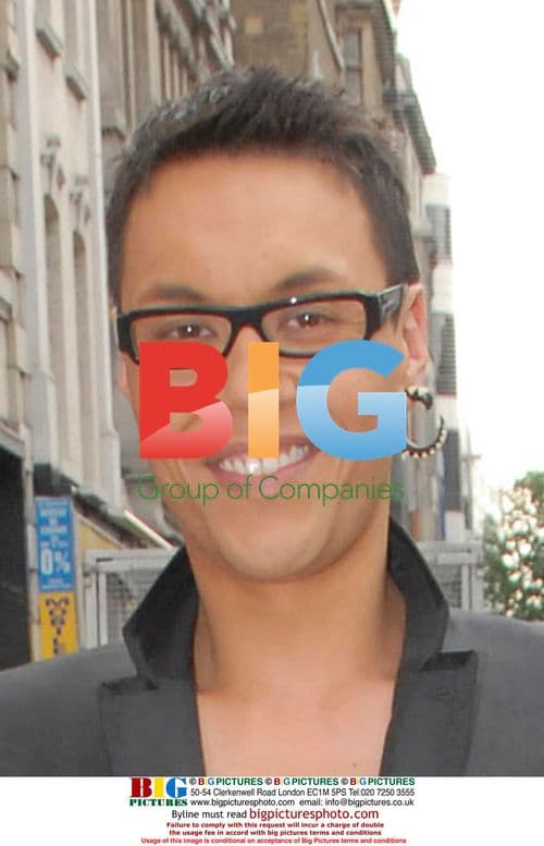 Gok Wan and friend stroll through London