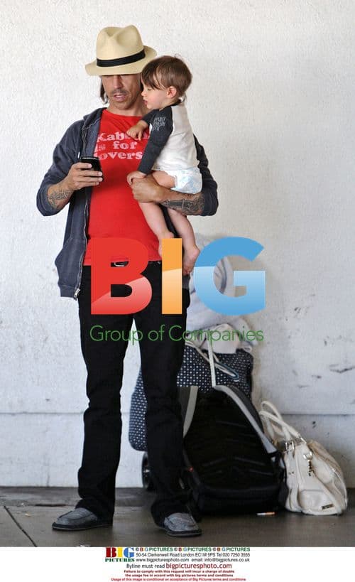 Anthony Kiedis at LAX with son and woman