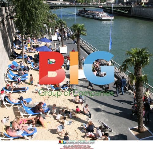 Visitors relax along the Seine during Paris Plages event