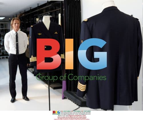 Belgian Designer Stijn Helsen Poses with Prince Laurent's Costume