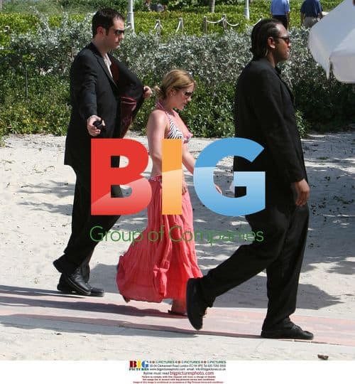 Heidi and sister relax on beach