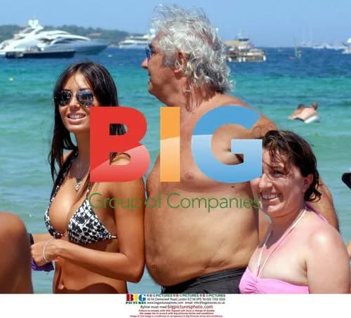 Flavio Briatore and Elisabetta Gregoraci on beach