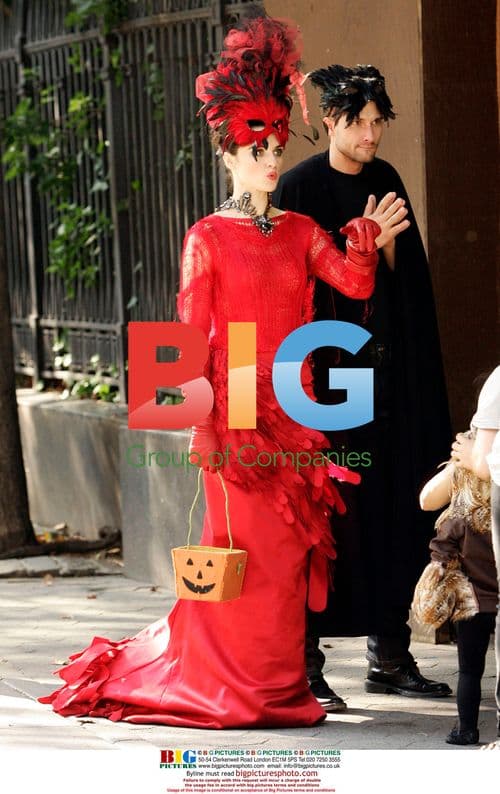 Rachel Weisz in Vibrant Red Costume for Vogue Shoot