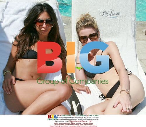 Courtney Semel and Casey Johnson by pool