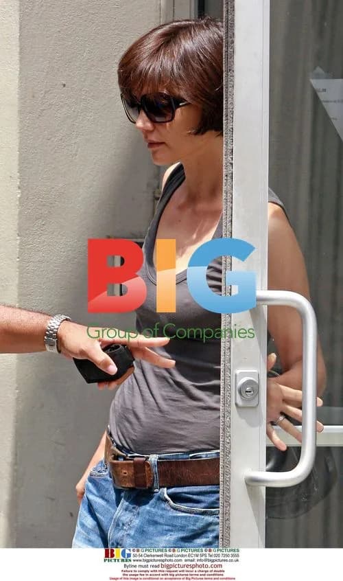Katie Holmes Exits Office in Men's Clothes