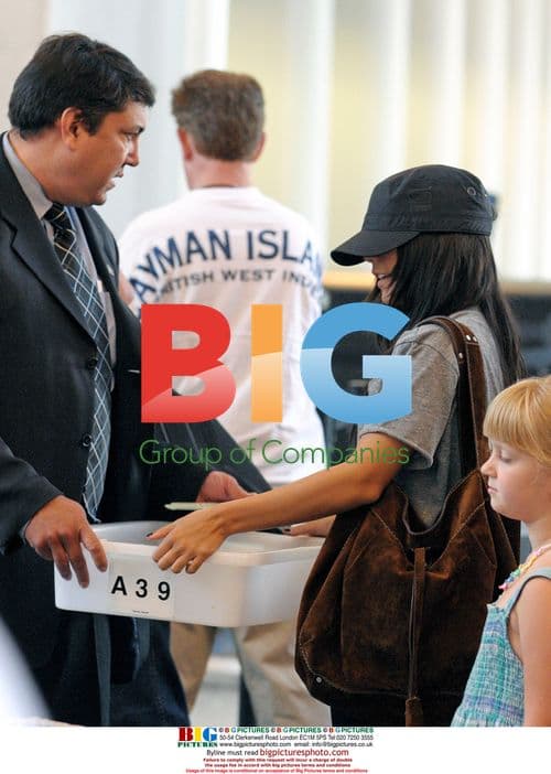 Vanessa Hudgens Departs LAX with Family