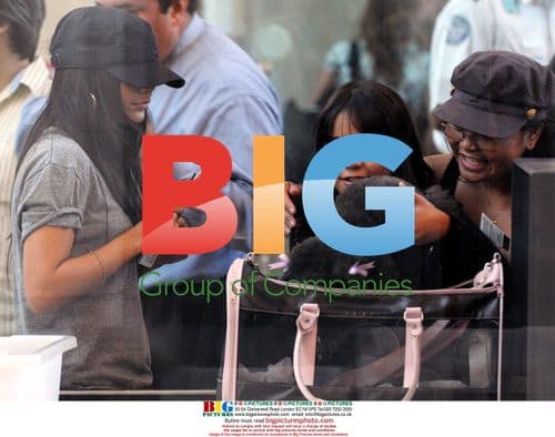 Vanessa Hudgens Departs LAX with Family