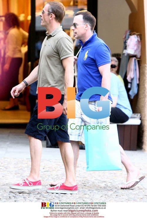 David Furnish seen shopping with mystery man