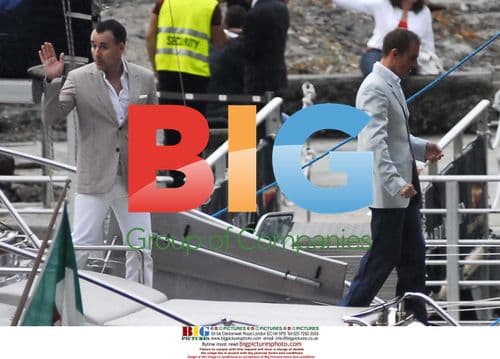 David Furnish seen relaxing with mystery man in Portofino