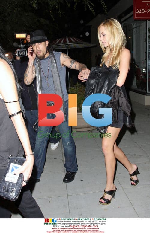 Dave Navarro leaves Crown Bar with mystery woman