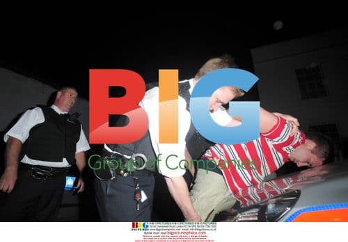 Amy Winehouse Intervenes in Photographer Attack