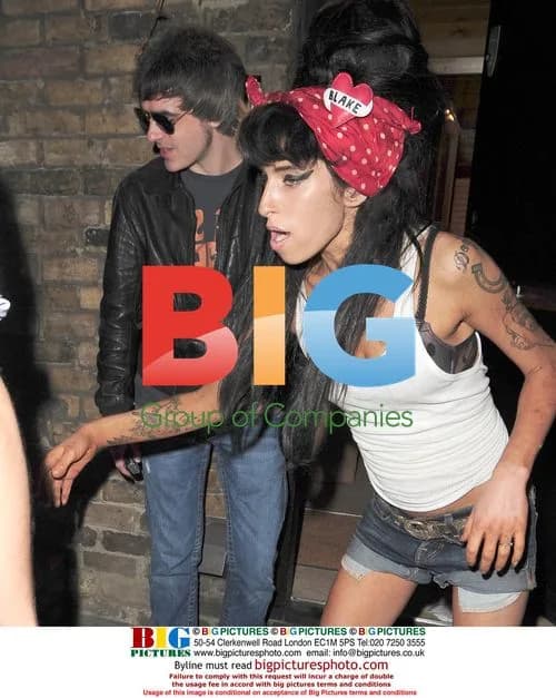 Amy Winehouse Checks on Photographers