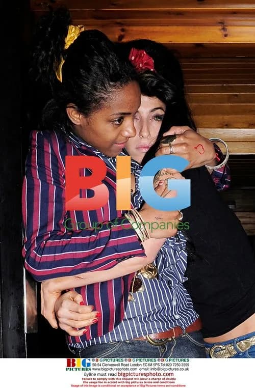 Amy Winehouse hugs friend in London