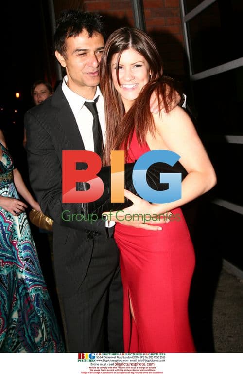 Lucy Evans kissing a man at charity event