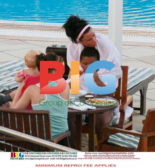 Katie Price with family at hotel pool