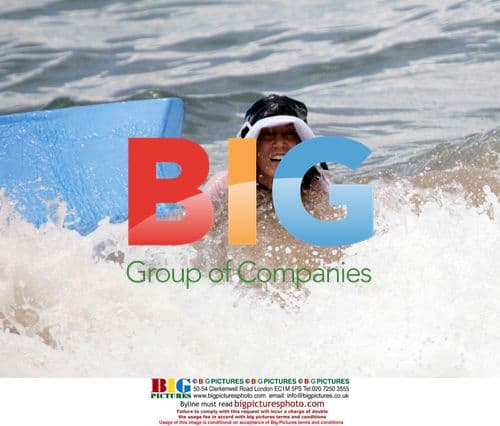 Felitcy Huffman and William Macy surfboarding in Maui