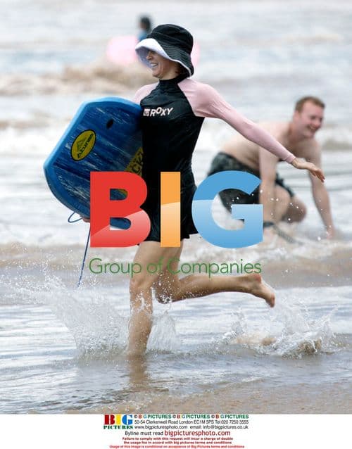 Felicity Huffman and William Macy Surfing in Maui