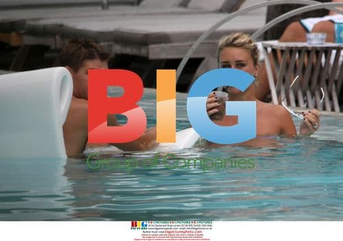 Steven Gerrard and wife Alex Curran in Miami pool