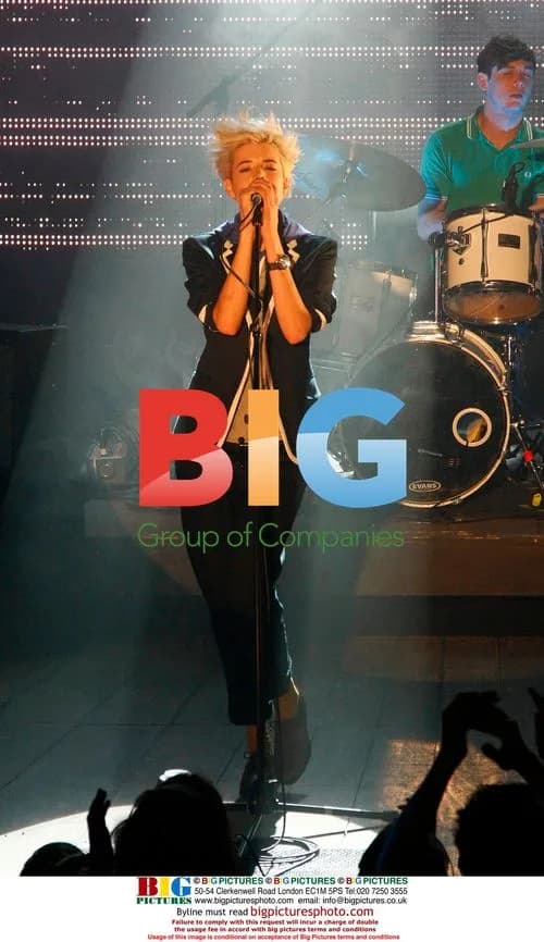 Agyness Deyn performs with The Five O'Clock Heroes