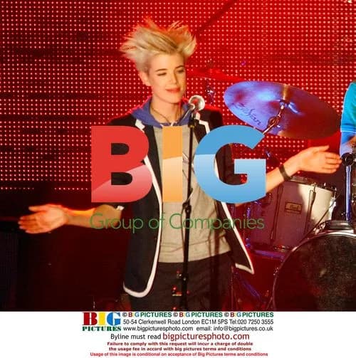 Agyness Deyn performs with The Five O'Clock Heroes