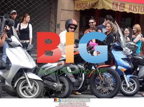 Keanu Reeves caught in the rain in Monaco