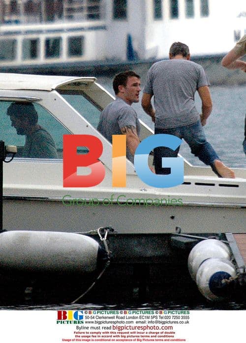 George Clooney boating with friends in Italy