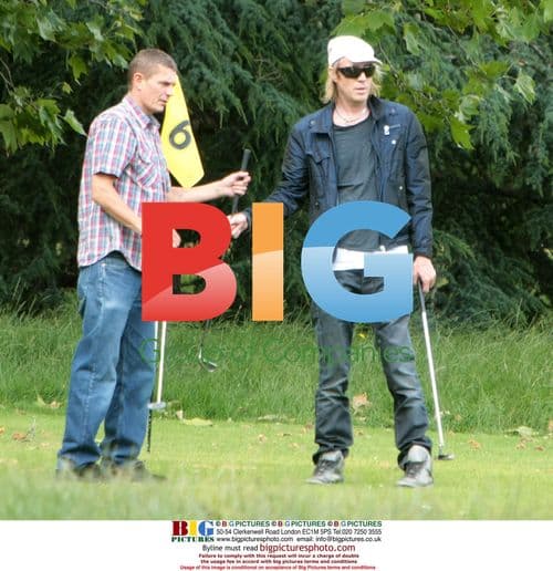 Rhys Ifans plays pitch and putt in London
