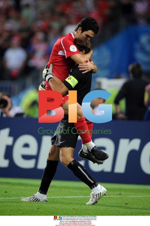 Arda Turan Celebrates With Teammate Recber Rustu