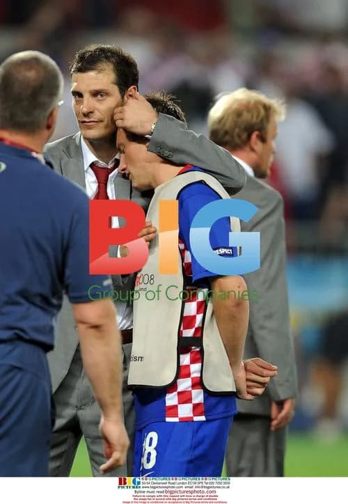 Slaven Bilic consoles Ivica Olic after Euro 2008 defeat