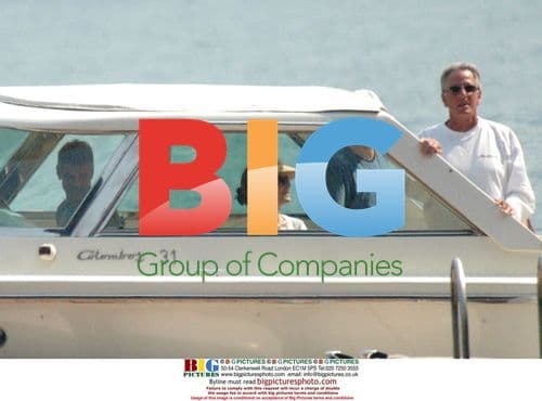 George Clooney on Boat in Lake of Como