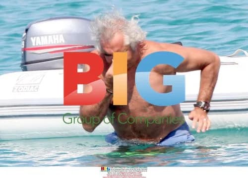 Renault F1 manager Flavio Briatore and wife on beach