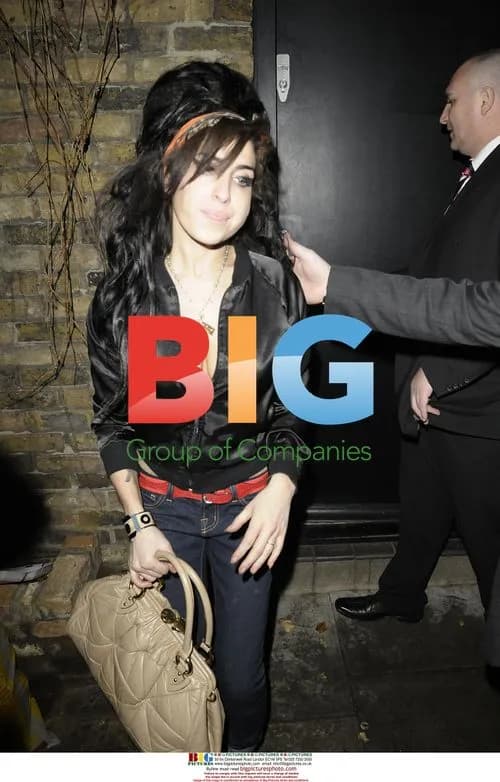 Amy Winehouse Departs for Paris for Fendi Party