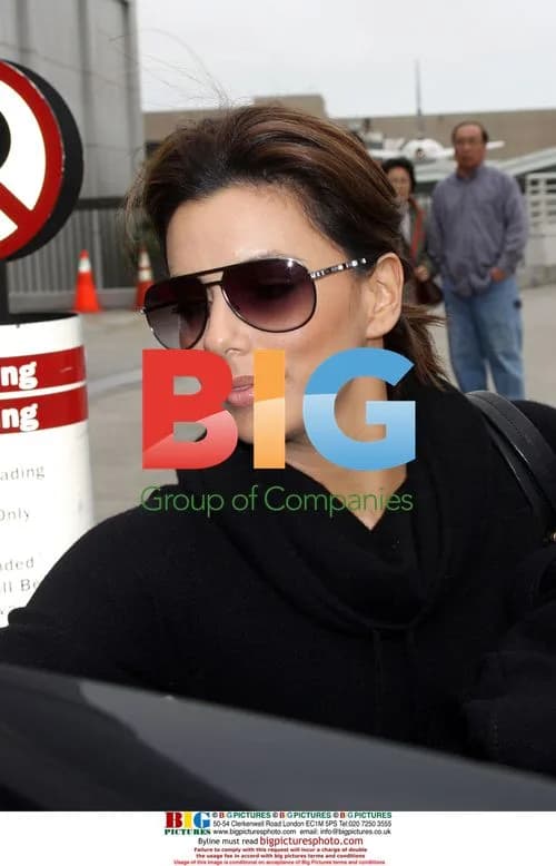 Eva Longoria Departs LAX with Pillow and Purse
