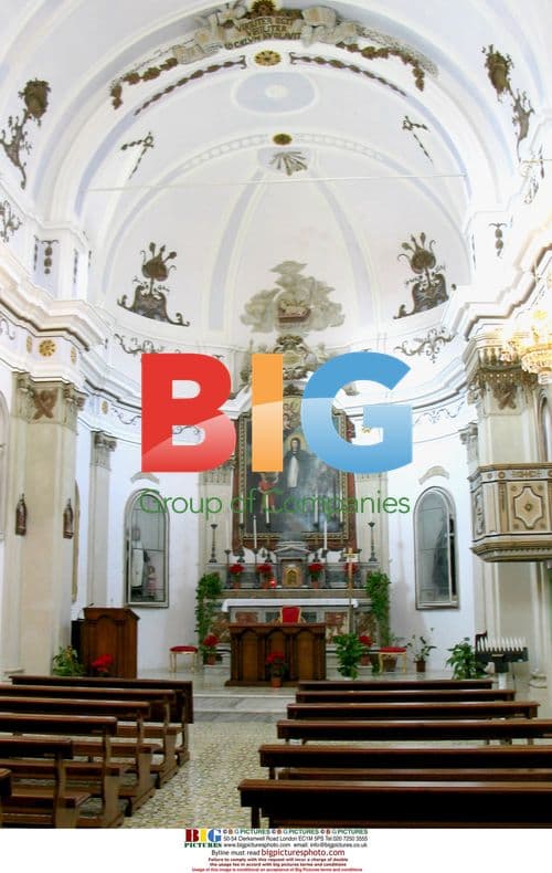 King Albert II helps restore Salina's church